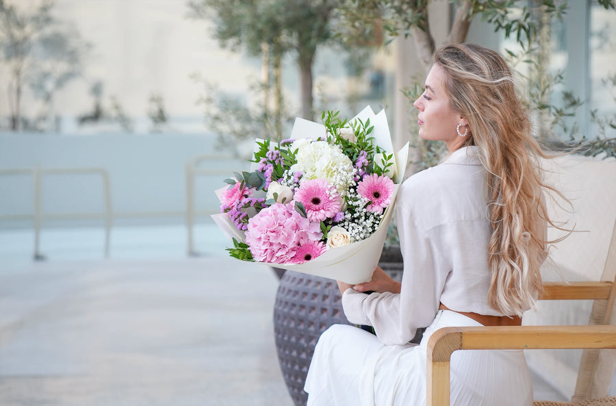 A florist holding a fresh Flowers.ie bouquet