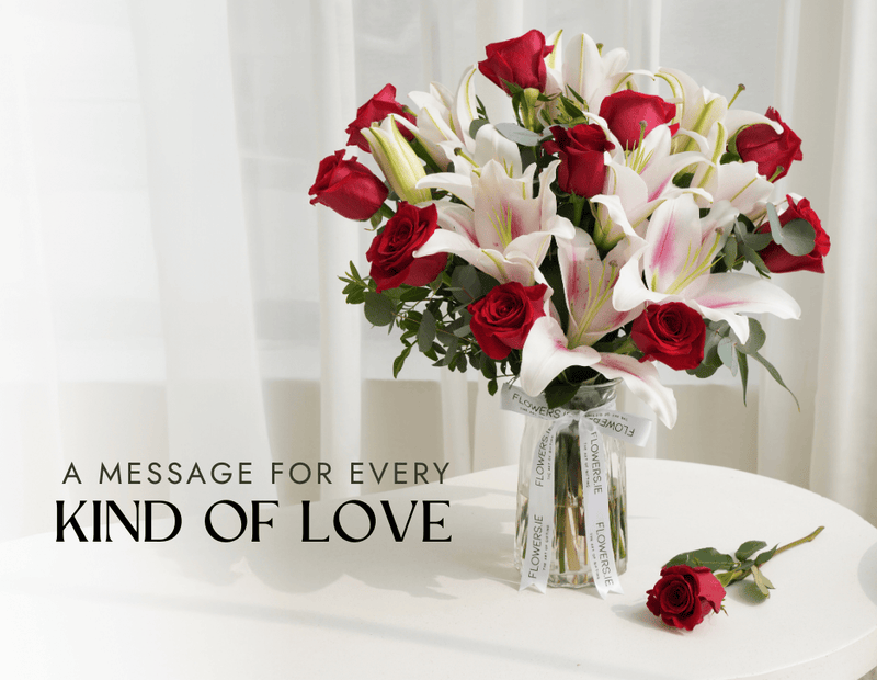 Red roses and pink oriental lilies arrangement in a glass vase with Flowers.ie ribbon, with a single red rose beside it