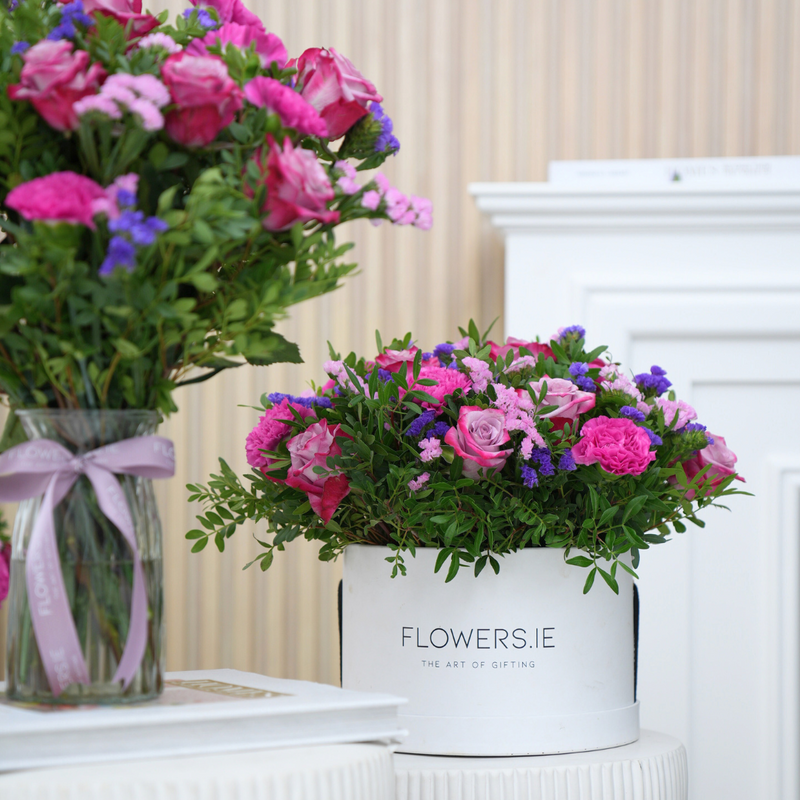  Pink roses, carnations and statice in a Flowers.ie hatbox with matching vase arrangement in background