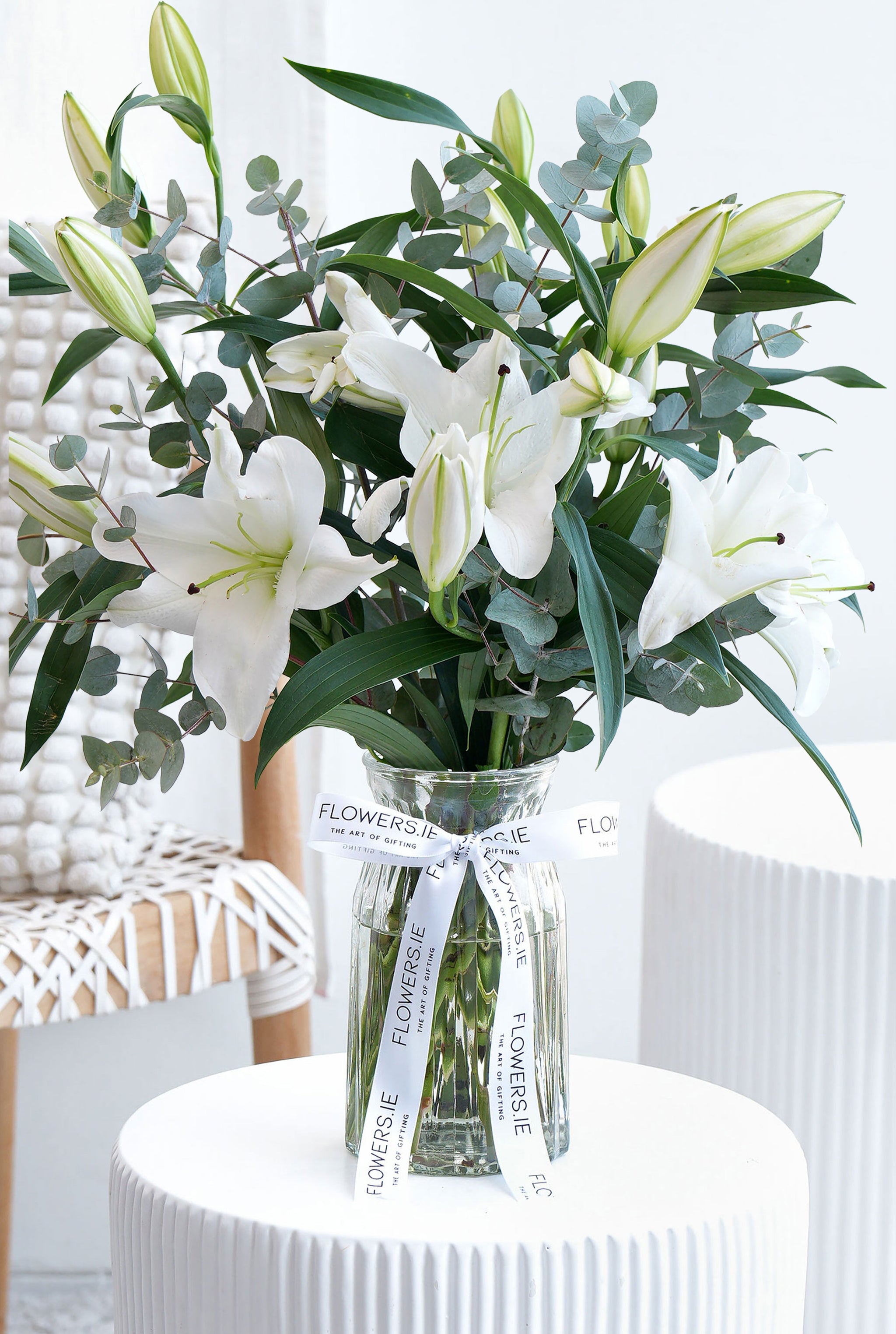 white lilies in glass vase White Scented Lily