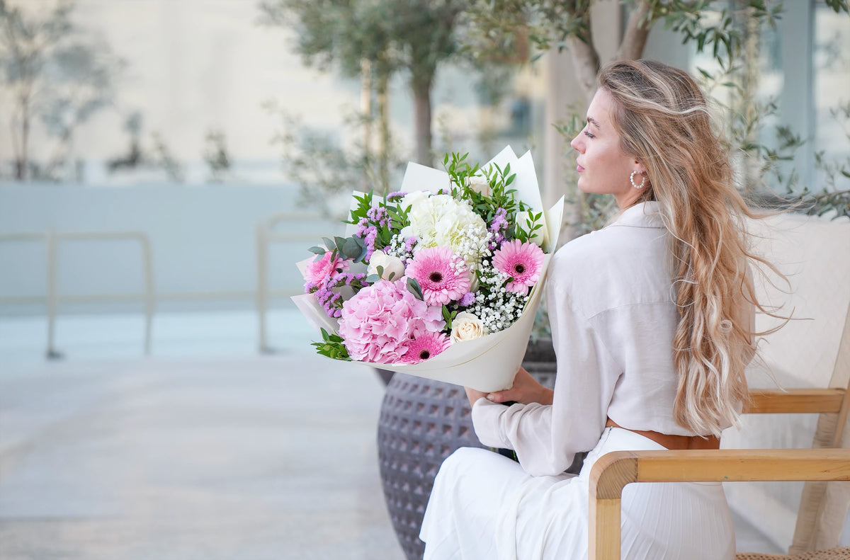 A florist holding a fresh Flowers.ie bouquet