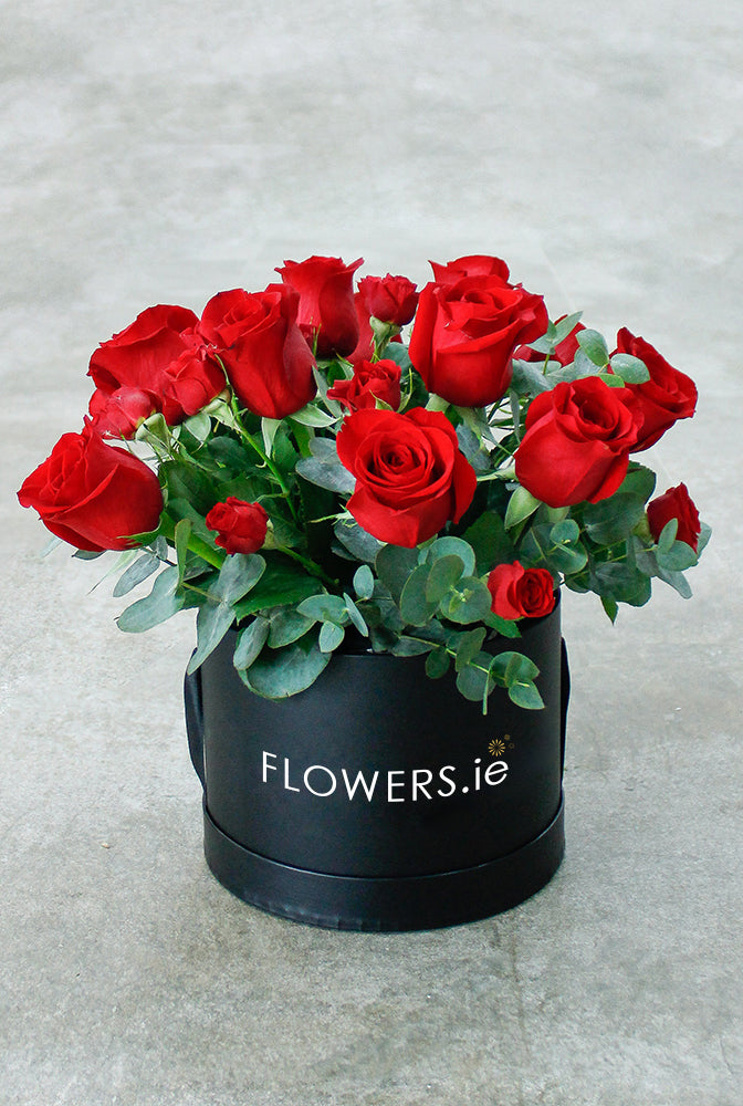 Dozen Red Deluxe Hatbox with Chocolates. Finest red roses. Have fresh flowers sent to you by Flowers.IE. Same day flower delivery available.