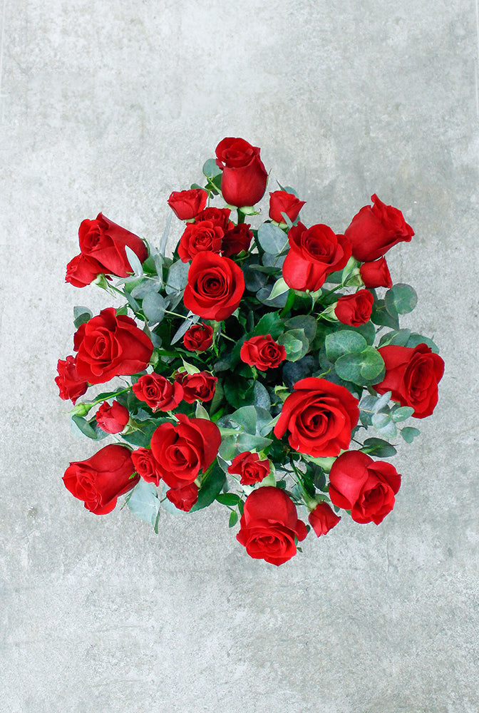 Dozen Red Deluxe Hatbox with Chocolates. Hand Created gift packaging. Get fresh flowers from Flowers.IE. Same day flower delivery available.